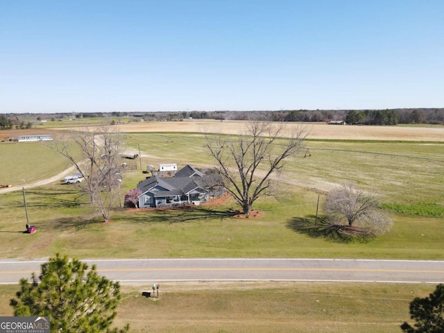 birds eye view of property featuring a rural view