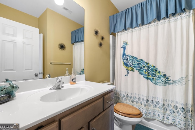 full bathroom with shower / bath combo, visible vents, toilet, and vanity
