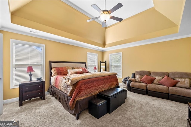 bedroom featuring a raised ceiling, carpet, visible vents, and crown molding