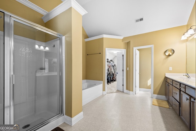 bathroom with a garden tub, a shower stall, and baseboards