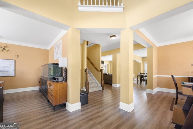 living room featuring crown molding, stairway, baseboards, and wood finished floors