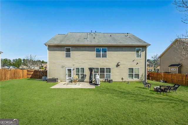 back of property with a yard, a patio, cooling unit, and a fenced backyard