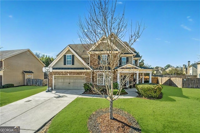 craftsman-style home featuring a garage, concrete driveway, fence, a front lawn, and brick siding