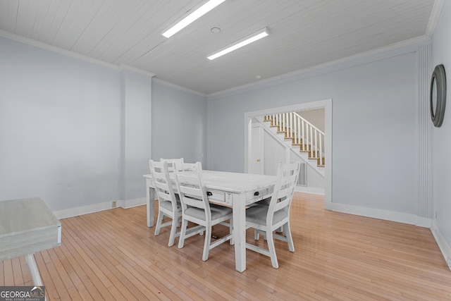 dining area with baseboards, wooden ceiling, stairway, ornamental molding, and light wood-type flooring