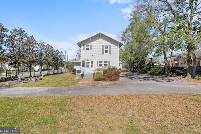 exterior space featuring fence and a yard