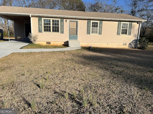 view of front facade with entry steps, concrete driveway, crawl space, a carport, and a front yard