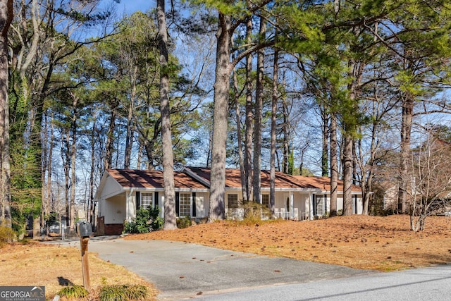 view of front of home with aphalt driveway