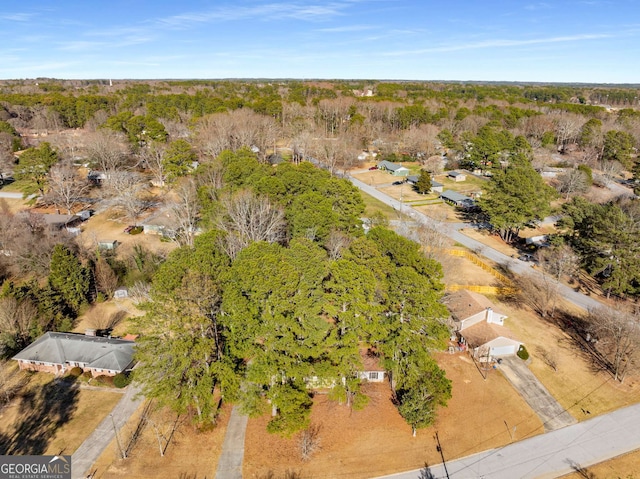 drone / aerial view with a view of trees