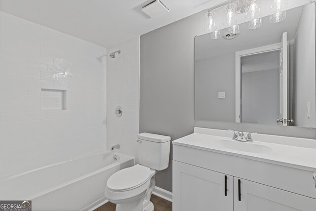 bathroom featuring visible vents, baseboards, toilet,  shower combination, and vanity