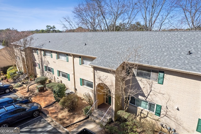 view of property featuring uncovered parking