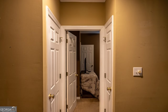 hall featuring light colored carpet