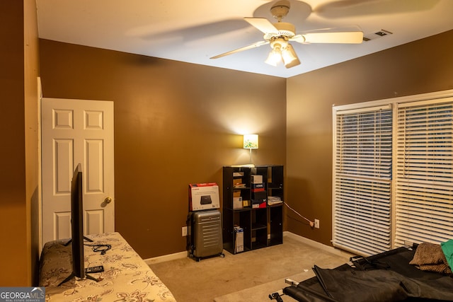 bedroom featuring light carpet, baseboards, visible vents, and ceiling fan