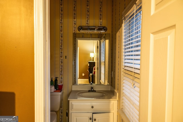 bathroom featuring vanity and toilet