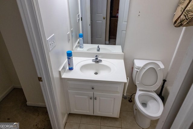 full bathroom featuring tile patterned flooring, vanity, and toilet