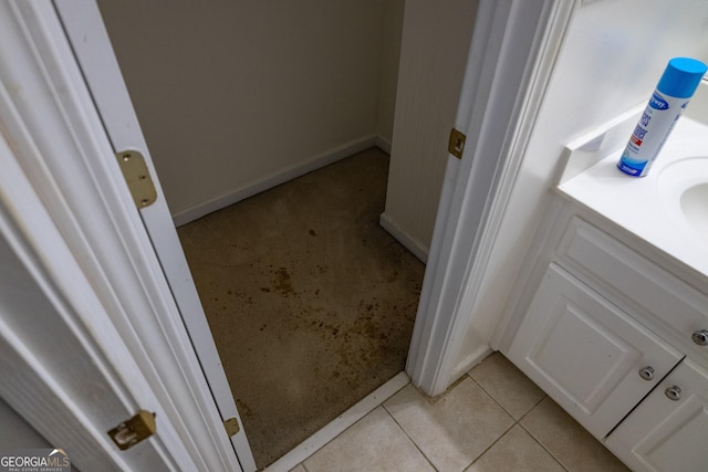 bathroom featuring tile patterned flooring and vanity