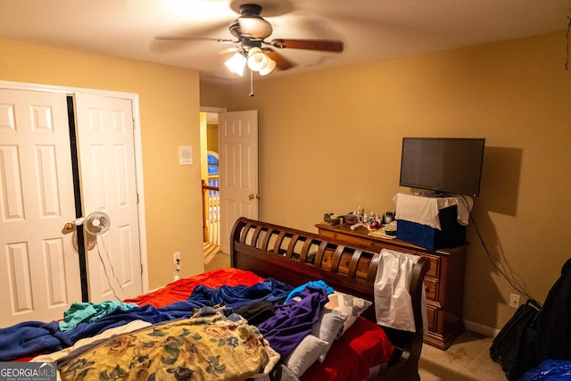 carpeted bedroom with a closet and a ceiling fan