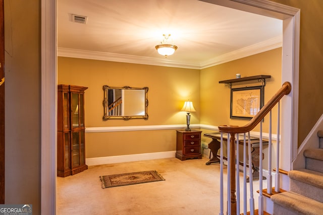 interior space with ornamental molding, stairway, visible vents, and baseboards