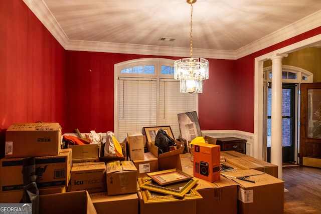 dining space featuring decorative columns, visible vents, and crown molding