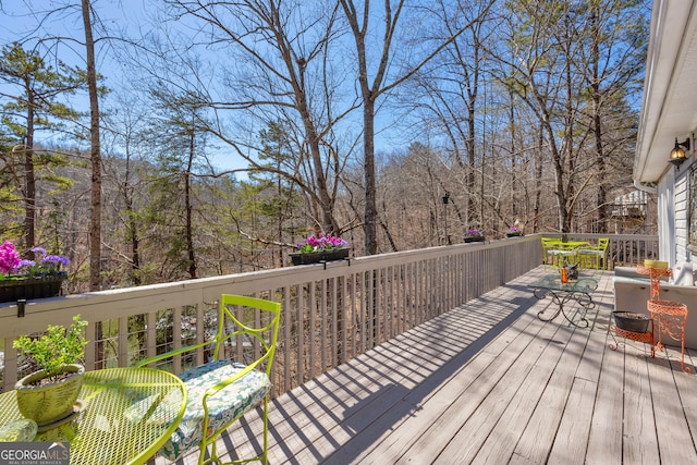 deck featuring a wooded view