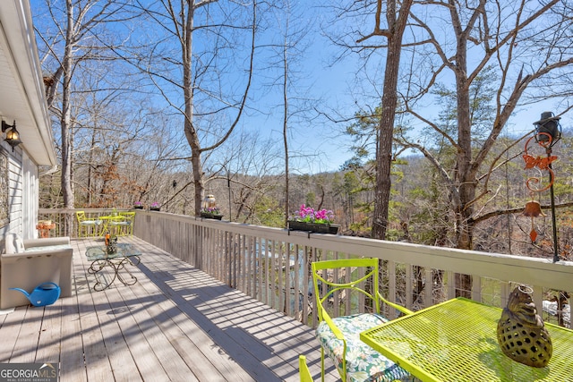 deck featuring a view of trees