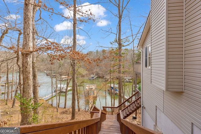 wooden deck with a water view