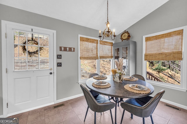 dining room with visible vents, vaulted ceiling, a wealth of natural light, and a chandelier