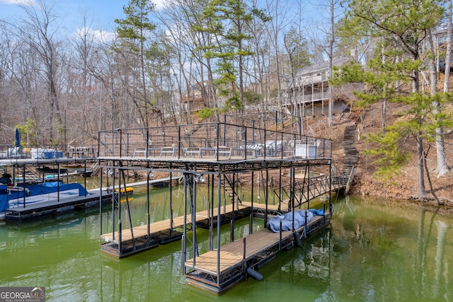 view of dock with a water view