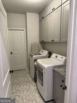 laundry room featuring cabinet space and washer and dryer