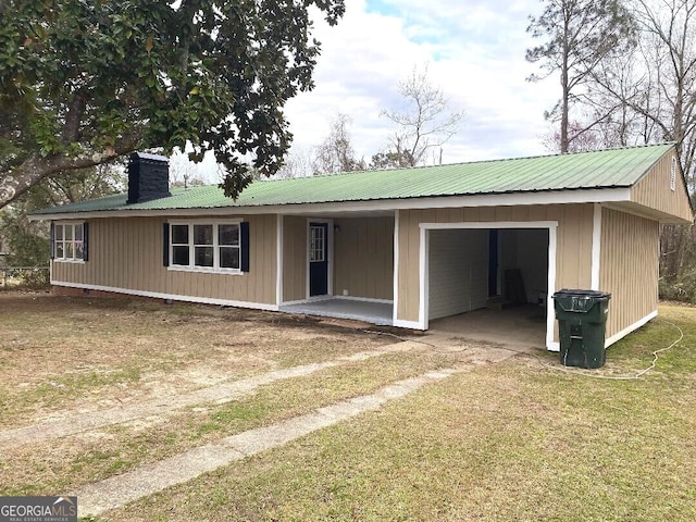 ranch-style house with metal roof and a chimney