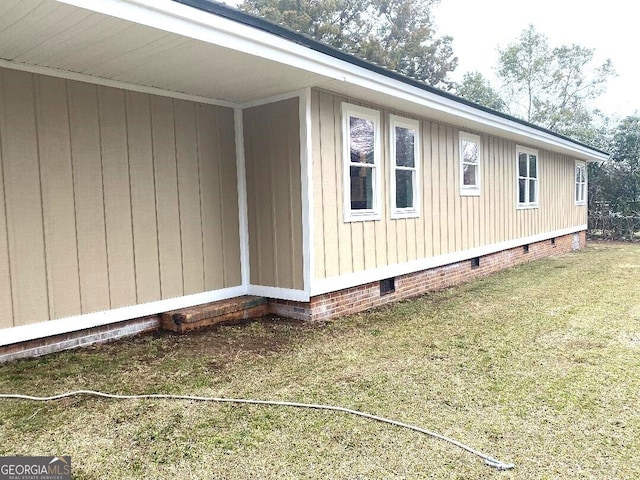 view of home's exterior featuring crawl space and a lawn