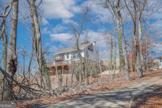 view of home's exterior with a balcony