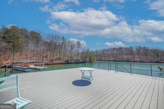 view of dock featuring a water view and a view of trees