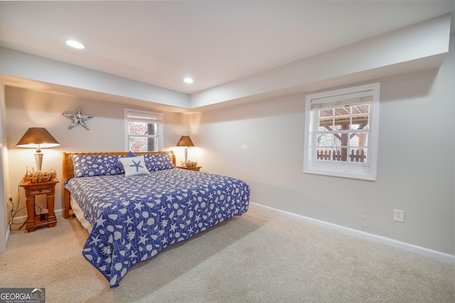 carpeted bedroom featuring recessed lighting and baseboards