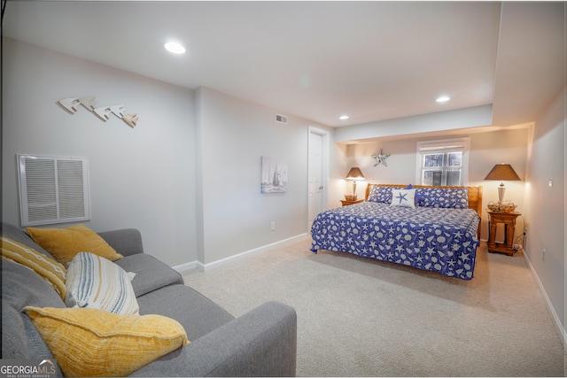 carpeted bedroom with recessed lighting, visible vents, and baseboards