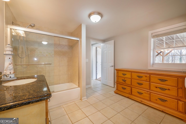 full bath with bath / shower combo with glass door, vanity, and tile patterned floors