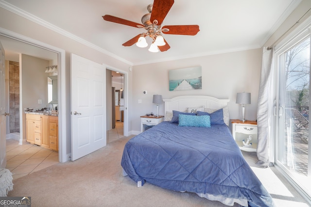 bedroom featuring ornamental molding, light carpet, connected bathroom, and ceiling fan