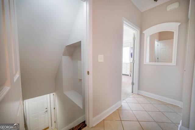 bathroom with baseboards and tile patterned floors