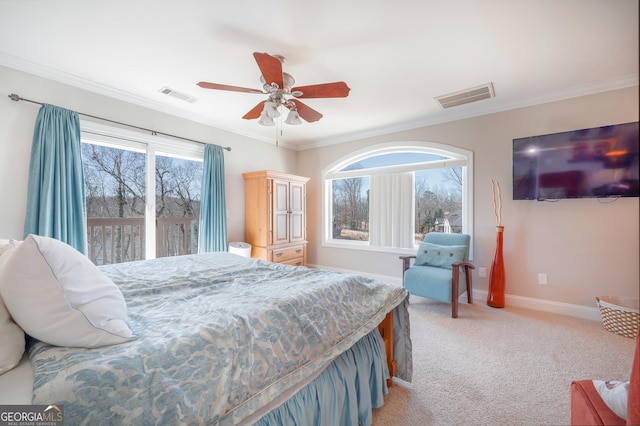 bedroom with multiple windows, visible vents, crown molding, and light colored carpet