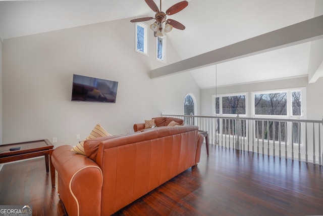 living room with dark wood-style floors, beam ceiling, high vaulted ceiling, and a ceiling fan