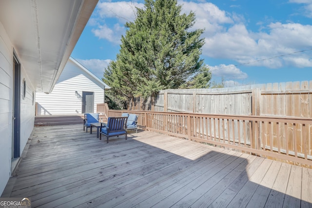 wooden deck featuring fence