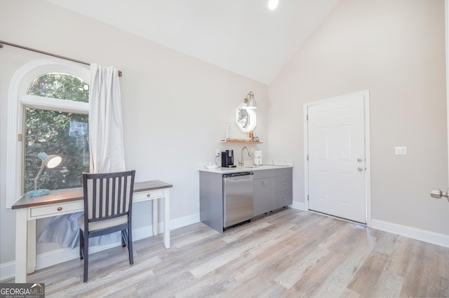 bar featuring dishwasher, high vaulted ceiling, light wood-type flooring, and baseboards