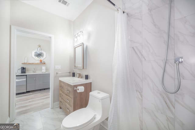 bathroom featuring visible vents, a shower with shower curtain, toilet, marble finish floor, and vanity