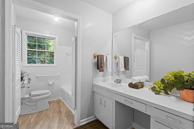 full bath with  shower combination, vanity, and toilet