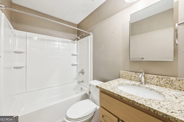 bathroom featuring  shower combination, vanity, and toilet