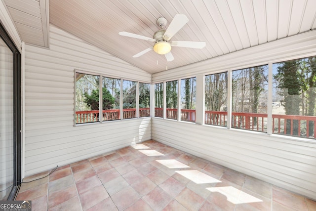 unfurnished sunroom with lofted ceiling, wood ceiling, and a ceiling fan