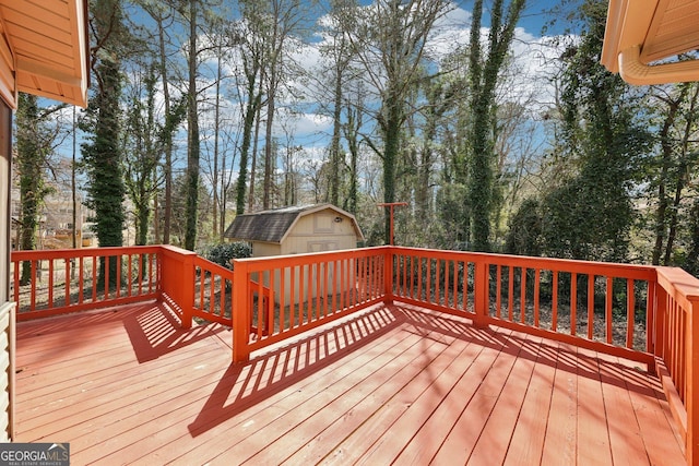 deck featuring a shed and an outbuilding