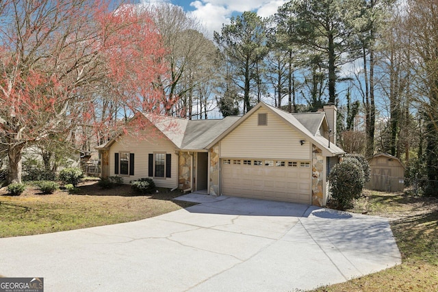 view of front of property with stone siding, concrete driveway, a chimney, and an attached garage