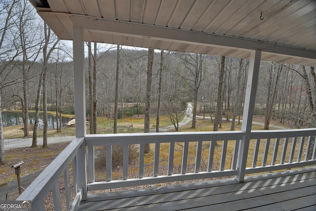 wooden deck with a water view