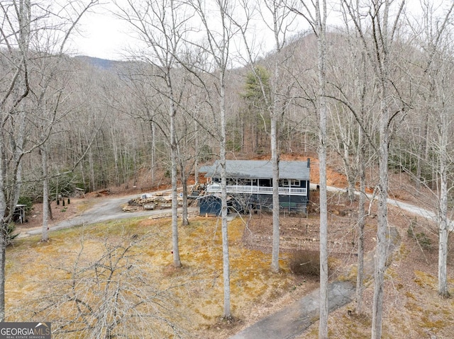 exterior space featuring a view of trees