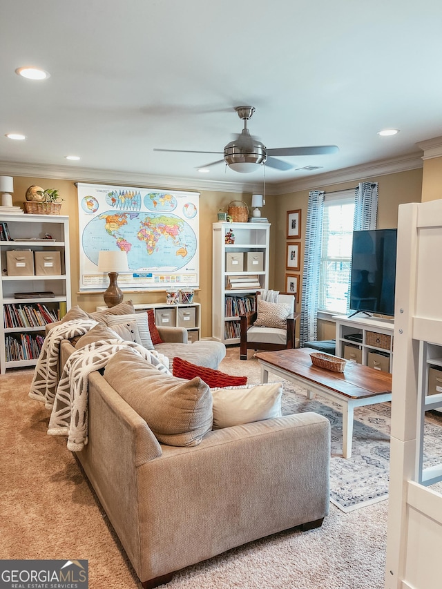 carpeted living area featuring ceiling fan, visible vents, crown molding, and recessed lighting